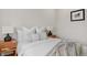 Bright bedroom with wood floors, and neutral decor at 1098 S Bryant St, Denver, CO 80219