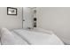 Simple bedroom with a queen bed and access to bathroom at 1098 S Bryant St, Denver, CO 80219