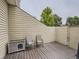 Private deck with chairs and small dog house at 7640 S Monaco Cir, Centennial, CO 80112