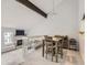 Open dining area with a table and chairs overlooking the living room at 7640 S Monaco Cir, Centennial, CO 80112