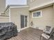 Backyard deck with patio furniture and grill at 7640 S Monaco Cir, Centennial, CO 80112