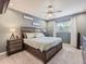 Spacious bedroom with large bed, ceiling fan, and window coverings at 7640 S Monaco Cir, Centennial, CO 80112