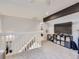 Loft area with TV, storage, and a view of the stairs at 7640 S Monaco Cir, Centennial, CO 80112