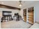 Home office with desk, bookshelves and TV at 7640 S Monaco Cir, Centennial, CO 80112