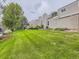 Neatly landscaped lawn with several trees at 7640 S Monaco Cir, Centennial, CO 80112