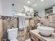 Updated bathroom with modern vanity, tile flooring, and a spacious shower at 7640 S Monaco Cir, Centennial, CO 80112