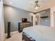 Bedroom with a bed, dresser, and a TV at 7640 S Monaco Cir, Centennial, CO 80112