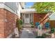 Brick and gray siding home with front patio at 2732 S Oakland E Cir, Aurora, CO 80014