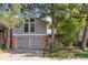 Two-story house with attached garage and landscaping at 2732 S Oakland E Cir, Aurora, CO 80014