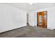 Bright bedroom featuring carpeted floors and a mirrored closet at 3640 S Sherman St, Englewood, CO 80113