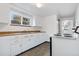 Bright kitchen with ample counter space and white cabinets at 3640 S Sherman St, Englewood, CO 80113