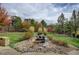 Landscaped backyard with water feature and grassy area at 7030 S Buchanan St, Aurora, CO 80016