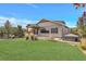 House exterior with backyard and fire pit at 7030 S Buchanan St, Aurora, CO 80016