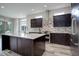 Modern kitchen with stainless steel appliances and a large island at 7030 S Buchanan St, Aurora, CO 80016