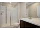 Clean bathroom with walk-in shower and modern vanity at 7030 S Buchanan St, Aurora, CO 80016
