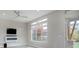 Living room with hardwood floors, fireplace, and large windows at 7030 S Buchanan St, Aurora, CO 80016