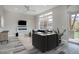 Living room with hardwood floors, fireplace, and access to backyard at 7030 S Buchanan St, Aurora, CO 80016