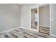 Additional office space with glass door and hardwood floors at 7030 S Buchanan St, Aurora, CO 80016
