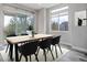 Dining area with hardwood floor, sliding glass doors to backyard, and a wooden table at 7030 S Buchanan St, Aurora, CO 80016