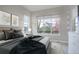 Bright bedroom with large window and plush bedding at 7030 S Buchanan St, Aurora, CO 80016