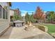 Flagstone patio with fire pit and hot tub at 7030 S Buchanan St, Aurora, CO 80016