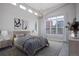 Elegant Primary bedroom with chandelier and large window at 7030 S Buchanan St, Aurora, CO 80016