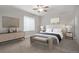 Spacious bedroom with neutral decor and modern furnishings at 7030 S Buchanan St, Aurora, CO 80016