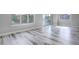 Bright dining area with hardwood floors and sliding glass doors leading to a patio at 7030 S Buchanan St, Aurora, CO 80016