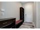 Entryway with built-in bench, storage, and modern flooring at 7030 S Buchanan St, Aurora, CO 80016