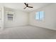 Bright bedroom with grey carpet and ceiling fan at 42986 Colonial Trl, Elizabeth, CO 80107