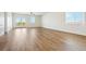 Bright living room featuring hardwood floors and large windows at 42986 Colonial Trl, Elizabeth, CO 80107