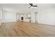 Open concept living room with hardwood floors and kitchen view at 42986 Colonial Trl, Elizabeth, CO 80107