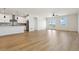 Spacious living room with light hardwood floors and access to a patio at 42986 Colonial Trl, Elizabeth, CO 80107