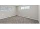 Well-lit bedroom with neutral decor and carpet flooring at 2230 Jamaica St, Aurora, CO 80010