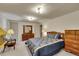 Basement bedroom with double dresser and blue bedding at 6769 W 70Th Ave, Arvada, CO 80003