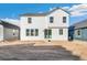 Back view of the house with a small backyard at 1562 Farmstead St, Brighton, CO 80601