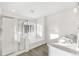Bright, white bathroom featuring dual vanities and soaking tub at 1562 Farmstead St, Brighton, CO 80601