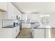 Spacious kitchen with ample counter space, white cabinets, and a large island at 1562 Farmstead St, Brighton, CO 80601