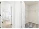 Spacious walk-in closet with built-in shelving located next to a bathroom at 1562 Farmstead St, Brighton, CO 80601