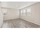 Spacious living room with hardwood floors and large windows at 18051 Dandy Brush Ln, Parker, CO 80134