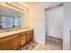 Primary bathroom with double vanity and walk-in closet at 20509 E Doane Dr, Aurora, CO 80013