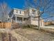 Two-story house with brick and siding, two-car garage, and landscaped yard at 20509 E Doane Dr, Aurora, CO 80013