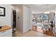 Kitchen view of condo, showing stainless steel appliances and adjacent dining area at 750 S Clinton St # 12D, Denver, CO 80247