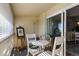 Small patio with white table and chairs at 750 S Clinton St # 12D, Denver, CO 80247
