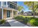 Modern townhome with blue door and landscaping at 888 S Valentia St # 104, Denver, CO 80247
