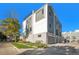 Rear view of modern townhome with garage access at 888 S Valentia St # 104, Denver, CO 80247