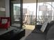 Living room with balcony access showcasing stunning city views at 1020 15Th St # 26I, Denver, CO 80202