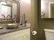 Bathroom features a granite countertop, vessel sink and modern fixtures at 1020 15Th St # 26I, Denver, CO 80202
