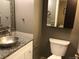 Bathroom boasts a granite countertop, vessel sink and modern fixtures at 1020 15Th St # 26I, Denver, CO 80202