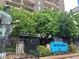 Brooks Tower entrance with lush landscaping and historic statue at 1020 15Th St # 26I, Denver, CO 80202